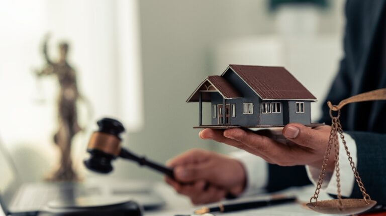 Lawyer is holding house model